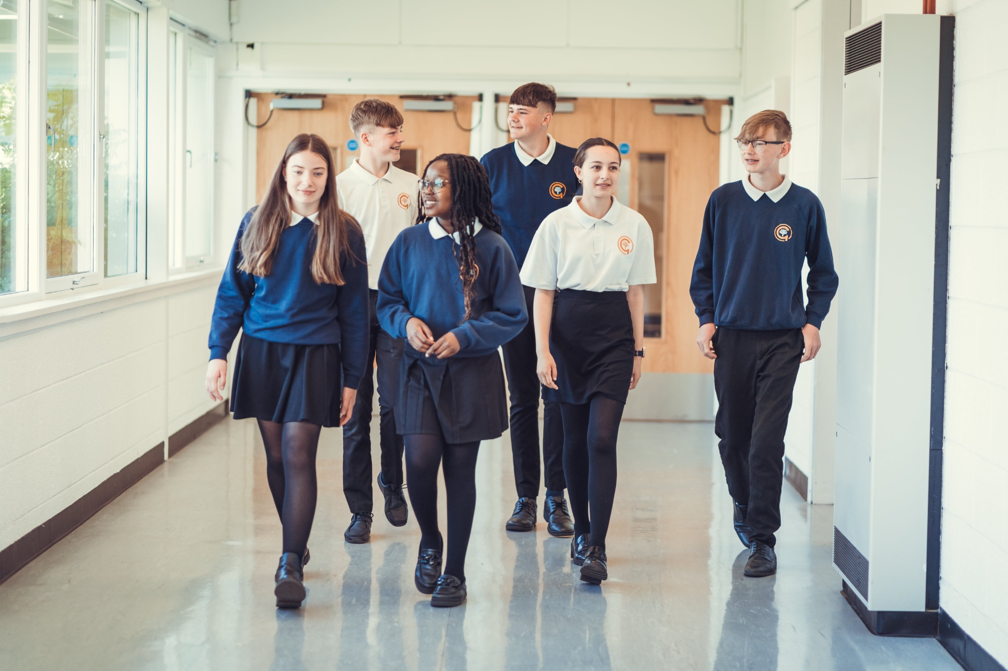 Children walking down the corridor together